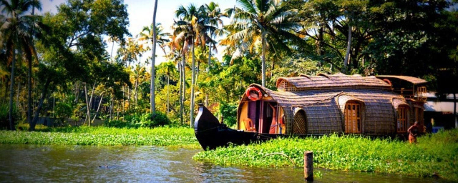 Traditional houseboat on Kerala backwaters surrounded